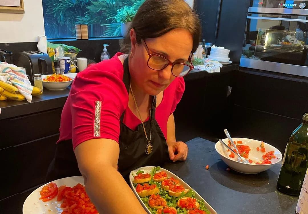 Chef Maria plating bruschetta